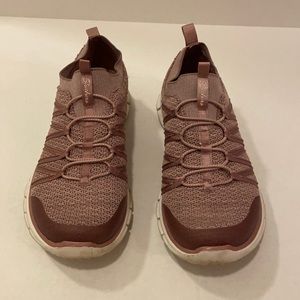 Purple sketchers slip on sneakers.